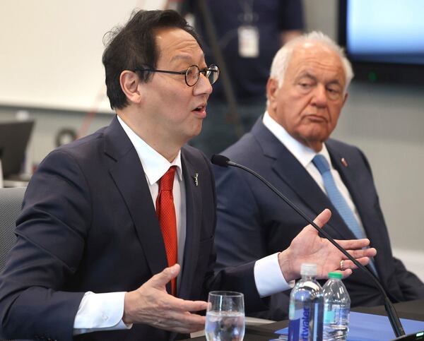 University of Florida president-elect Santa Ono, left, answers a question, as Mori Hosseini, right, chairman of the UF Board of Trustees listens, during a meeting of the Florida Board of Governors to vote on Ono becoming Florida's 14th president at the University of Central Florida's downtown campus in Orlando, Fla., Tuesday, June 3, 2025. (Joe Burbank/Orlando Sentinel via AP)