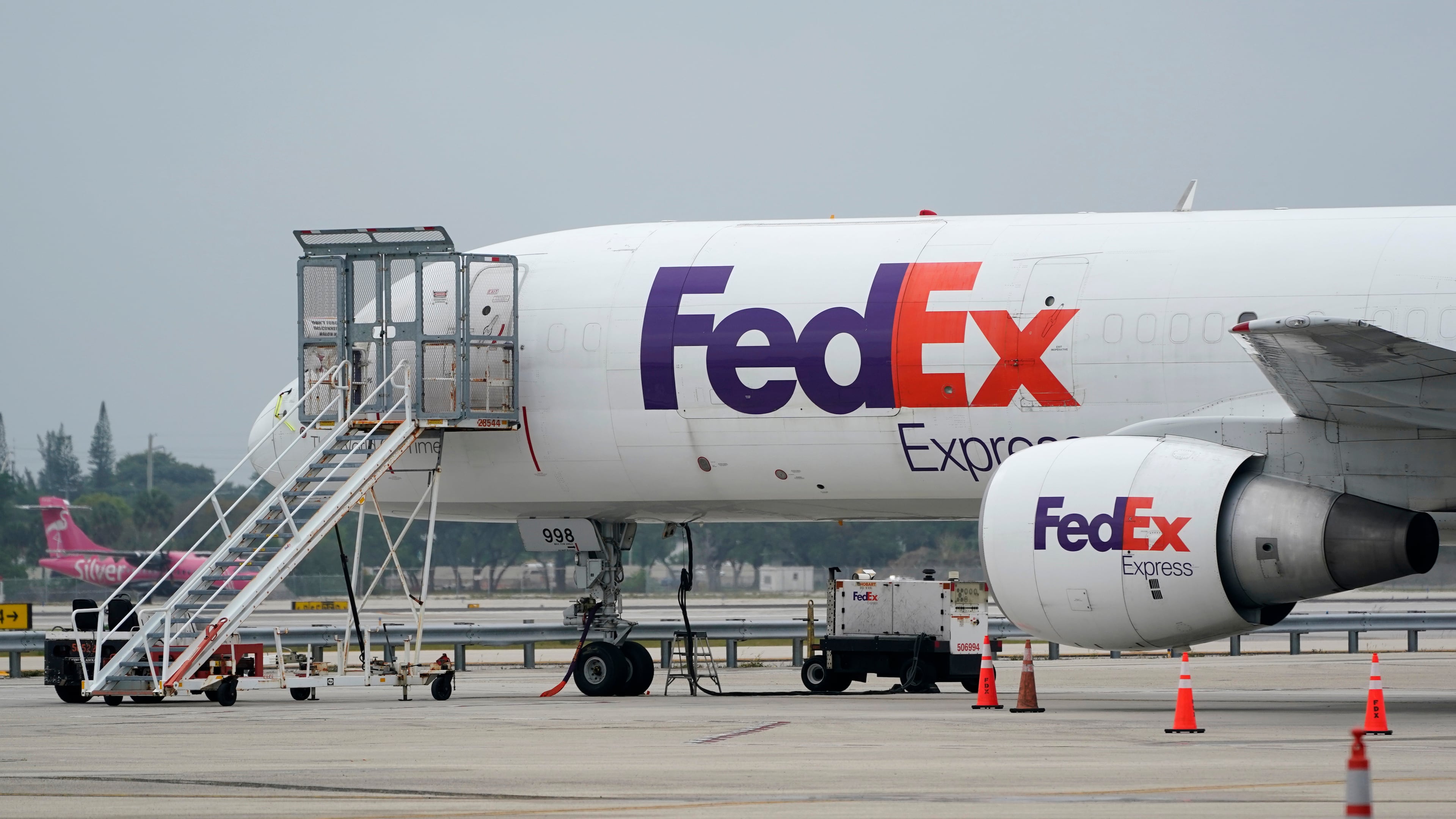 FILE - A FedEx cargo plane is shown on the tarmac at Fort Lauderdale-Hollywood International Airport, Tuesday, April 20, 2021, in Fort Lauderdale, Fla. (AP Photo/Wilfredo Lee, File)