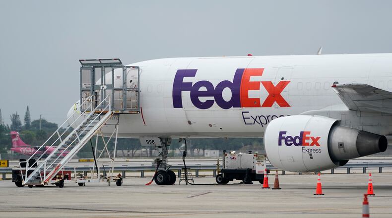FILE - A FedEx cargo plane is shown on the tarmac at Fort Lauderdale-Hollywood International Airport, Tuesday, April 20, 2021, in Fort Lauderdale, Fla. (AP Photo/Wilfredo Lee, File)