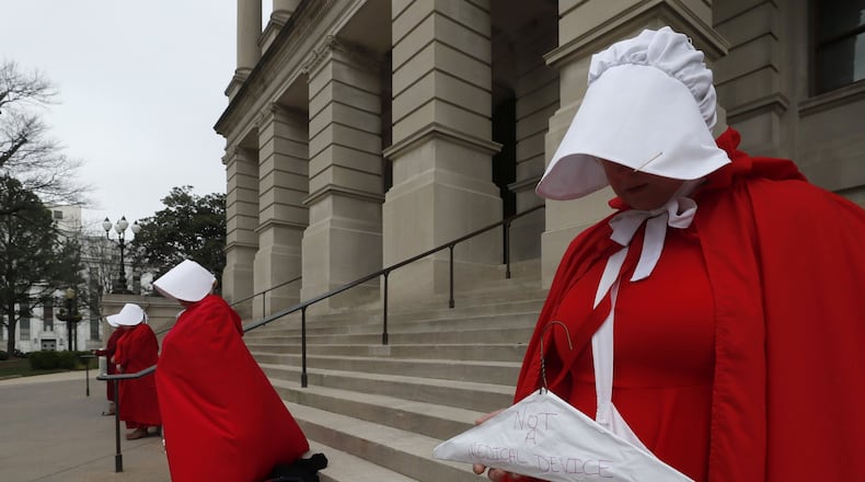 Georgia members of the Handmaid Coalition protested against House Bill 481 outside the state Capitol on Friday. Now that the House has passed HB 481, the Senate is now tasked with tackling legislation that would ban most abortions after six weeks. The House approved the legislation late Thursday, and advocates on both sides of the issues have already begun pushing senators to vote their way. Bob Andres / bandres@ajc.com