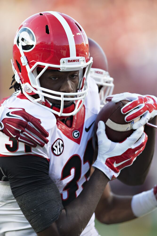 Chubb rushes for 202 yards in 45-32 win