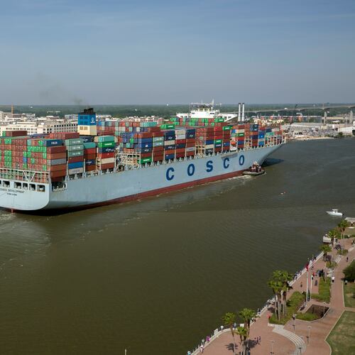 In this photo provided by the Georgia Ports Authority, the container ship COSCO Development sails up river past the historic district of Savannah, Ga., to the Port of Savannah, on Thursday, May 11, 2017. At 1,201 feet long and 158 feet wide, the ship, at the time, was the largest vessel ever to call on the U.S. East Coast. (AP Photo/Georgia Ports Authority, Stephen Morton)