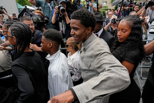 Family members of Sean "Diddy" Combs, react as they leave Manhattan federal court after Combs' was convicted of a prostitution-related offense but acquitted on the most serious charges at his New York trial, Wednesday, July 2, 2025, in New York. (AP Photo/Yuki Iwamura)