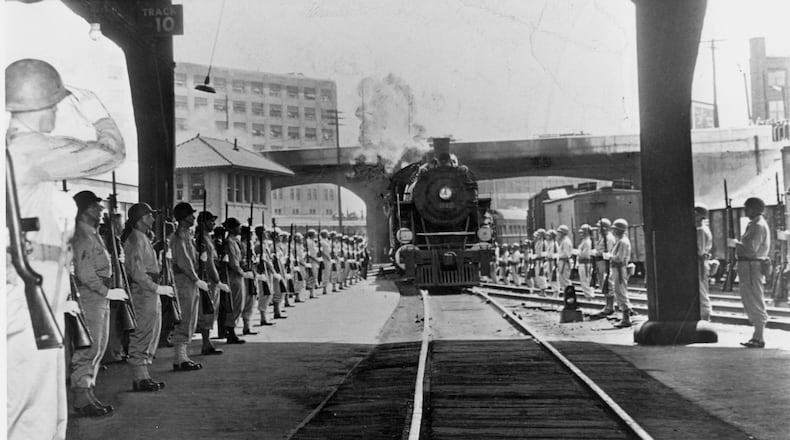 April 1945 -- An armed guard from Camp Sibert presents arms as the special funeral train bearing the body of President Roosevelt pulls into Atlanta's Terminal Station on its way from Warm Springs, Ga., to Washington, D.C.