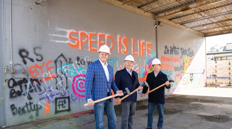 Demolition has begun to make way for a mixed-use space at 14th Street and Howell Mill Road. From left to right: Jeff Garrison, Steve Collins and Jeff DeHart with S.J. Collins Enterprises at the demo-day event. CONTRIBUTED