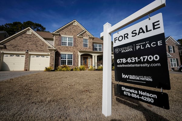 FILE - A sign announcing a home for sale is posted outside a home, Thursday, Feb. 1, 2024, in Aceworth, Ga., near Atlanta. (AP Photo/Mike Stewart, File)