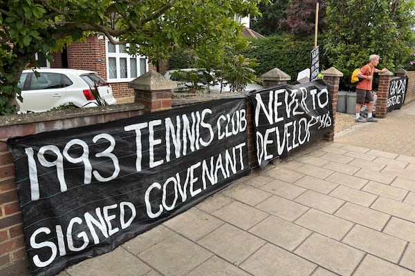 A banner opposed to Wimbledon's major expansion plan is placed outside a house leading to the All England Club where the Wimbledon Tennis Championships take place in London, Saturday, July 5, 2025. (AP Photo/Tony Hicks)