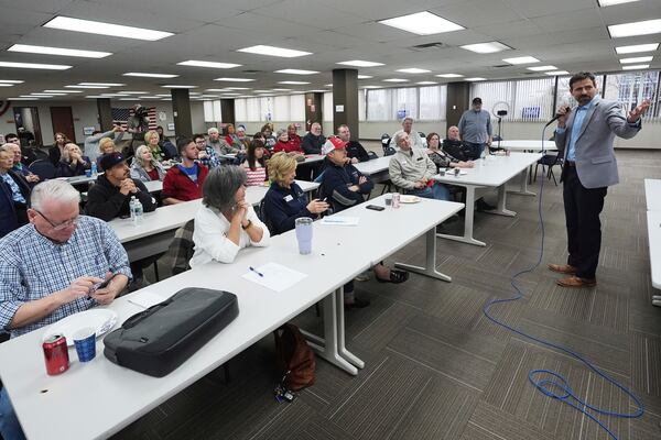 Ryan Kelley, right, speaks at the Jackson County Republican headquarters, Thursday, April 10, 2025, in Jackson, Mich. (AP Photo/Paul Sancya)