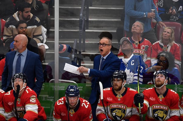 Florida Panthers coach Paul Maurice, center right, shouts instructions at his team during the second period of Game 4 of a second-round NHL hockey playoff series against the Toronto Maple Leafs, Sunday, May 11, 2025, in Sunrise, Fla. (AP Photo/Michael Laughlin)
