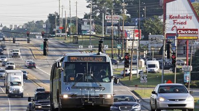 The Big Chicken watches over commuters on Cobb Parkway, July 2015. (AJC Photo / Bob Andres)