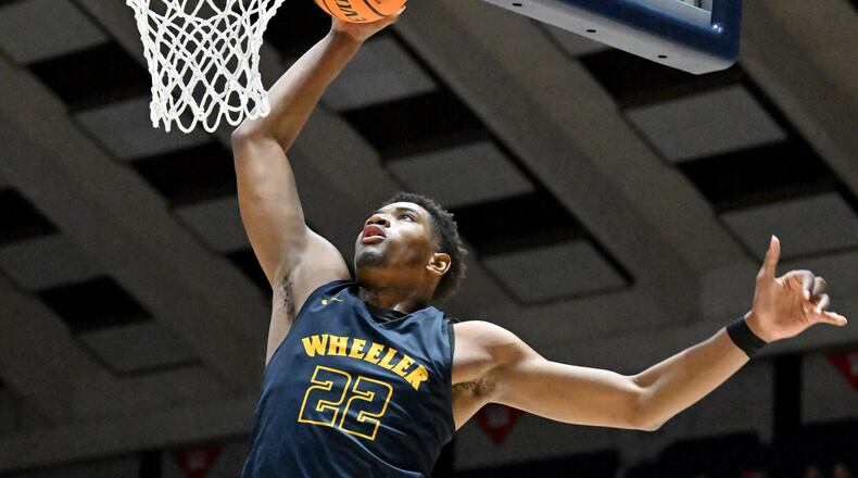 Wheeler's Arrinten Page (22) dunks the ball during 2023 GHSA Basketball Class 7A Boy’s State Championship game at the Macon Centreplex, Saturday, March 11, 2023, in Macon, GA. (Hyosub Shin / Hyosub.Shin@ajc.com)