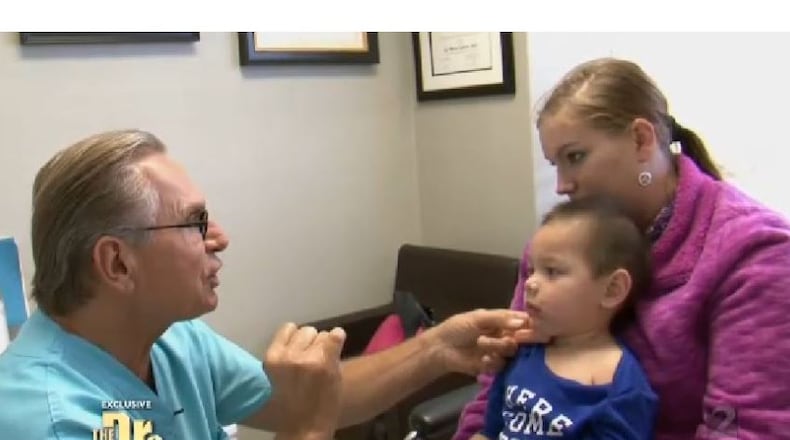 Plastic surgeon and reconstructive surgery expert Dr. Andrew Ordon examines Bounkham “Baby Boo Boo” Phonesavanh/ABC