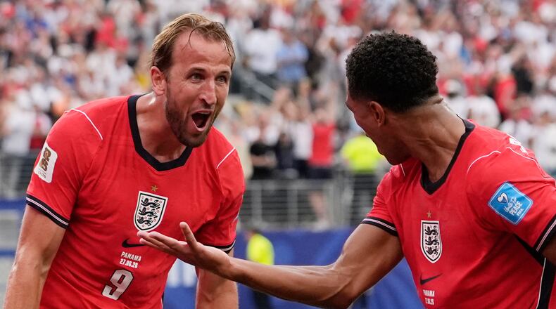 England's Harry Kane (9) celebrates with England's Jude Bellingham (10) after scoring their second goal during the World Cup Group L soccer match between Panama and England in East Rutherford, N.J., near New York, Saturday, June 27, 2026. (AP Photo/Steve Luciano)