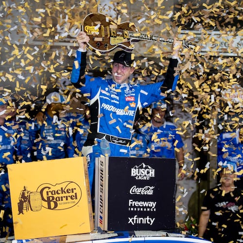 Denny Hamlin celebrates after winning a NASCAR Cup Series auto race, Sunday, May 31, 2026, in Lebanon, Tenn. (AP Photo/Camden Hall)