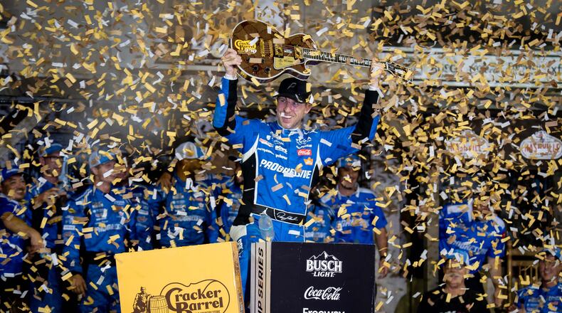 Denny Hamlin celebrates after winning a NASCAR Cup Series auto race, Sunday, May 31, 2026, in Lebanon, Tenn. (AP Photo/Camden Hall)