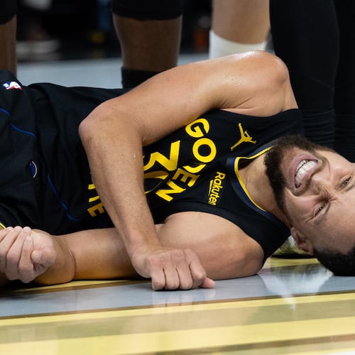 Golden State Warriors guard Stephen Curry lies on the floor during the second half of an Emirates NBA Cup basketball game against the Houston Rockets Wednesday, Nov. 26, 2025, in San Francisco. (AP Photo/Benjamin Fanjoy)