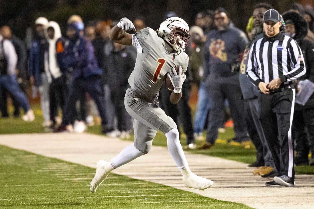 Creekside running back Gary Walker makes a catch during the first half of the class 4A semifinal against Kell at Creekside High School on Friday. (Oscar Guevara Saenz for the AJC)