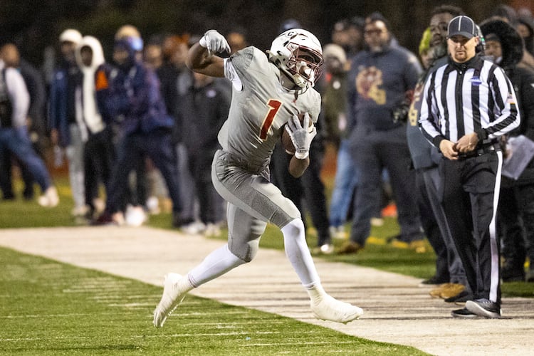 Creekside running back Gary Walker makes a catch during the first half of the class 4A semifinal against Kell at Creekside High School on Friday. (Oscar Guevara Saenz for the AJC)