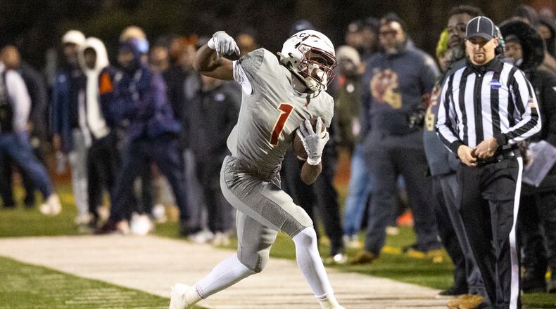 Creekside running back Gary Walker makes a catch during the first half of the class 4A semifinal against Kell at Creekside High School on Friday. (Oscar Guevara Saenz for the AJC)
