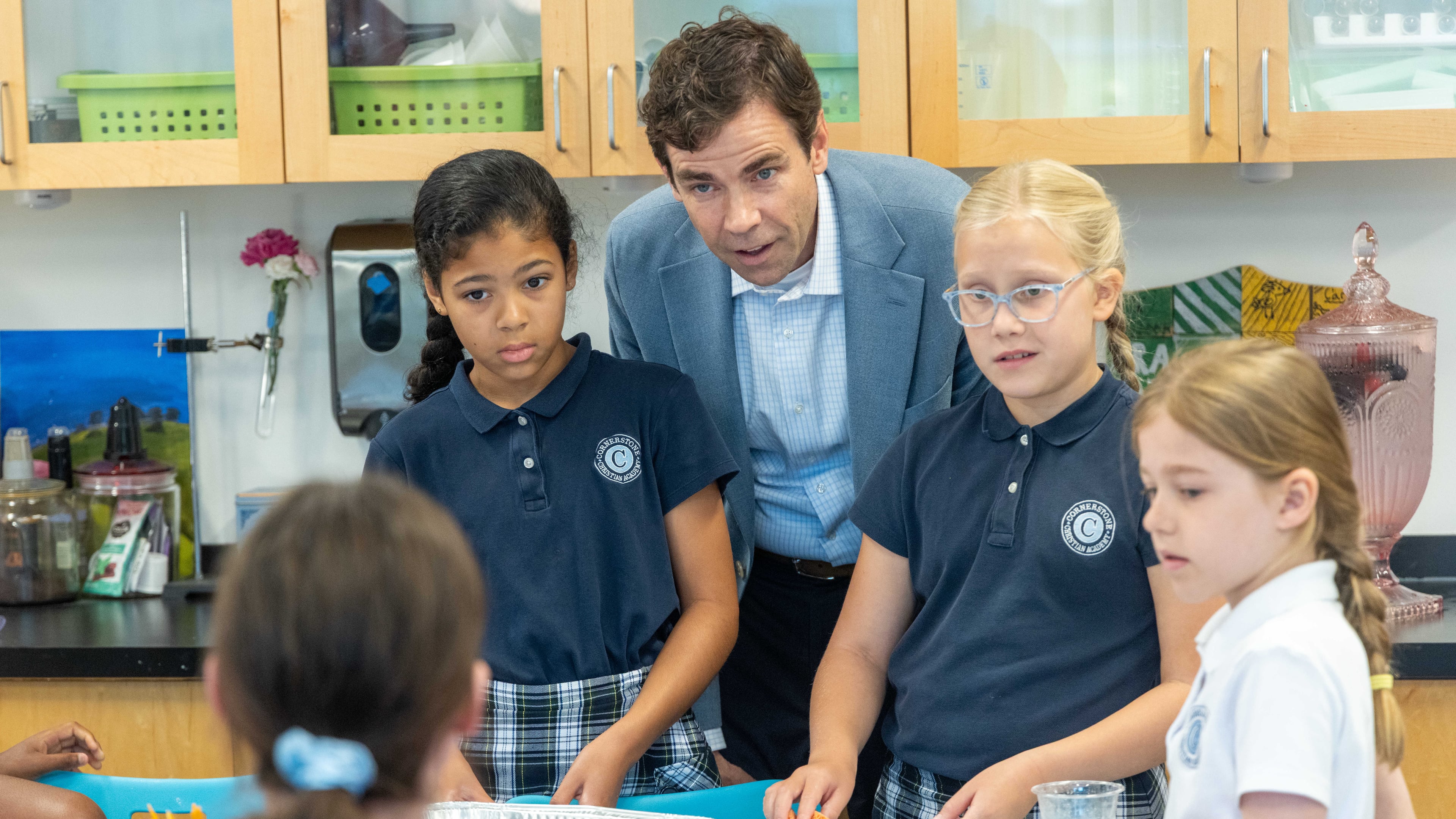 Colin Creel, headmaster of Cornerstone Christian Academy in Peachtree Corners, checks in with students. Creel has overseen the school’s steady growth and deepening culture for more than a decade. (Phil Skinner for the AJC)
