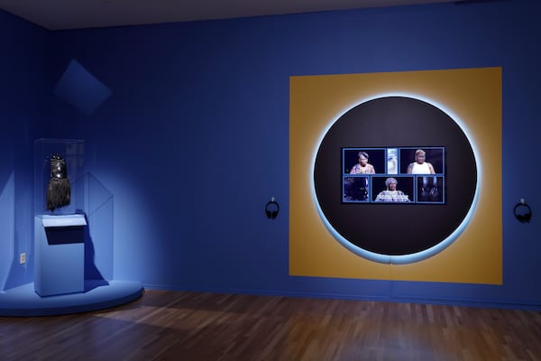 Masud Olufani’s exhibit within "Call and Response" responds to the Mende mask on the left. (Courtesy of Mike Jensen/The Carlos Museum)