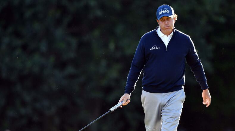 Phil Mickelson reacts after he hits a long putt on the 15th hole. Play begins in the second round of the 81st Masters tournament at the Augusta National Golf Club Friday. (Brant Sanderlin/Special)