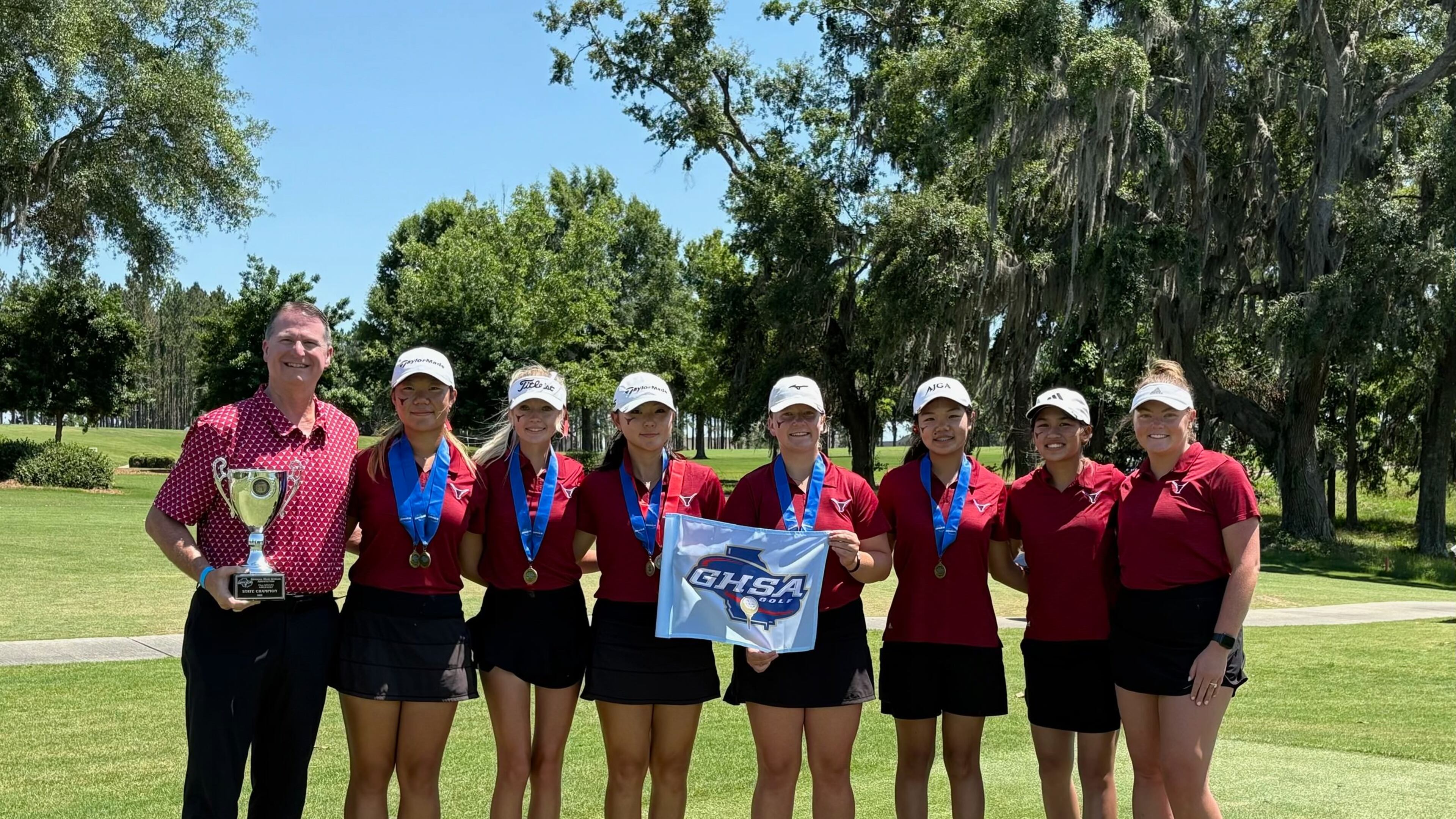The Lambert girls won their seventh straight state championship and 11th overall at Kinderlou Forest in Valdosta, May 20, 2025. (L-R) Coach Shane Fortenberry, Grace Lee, McKinlee Proctor, Athena Yoo, Zoe Duval, Fiona Kim, Kyla XCheung and assistant coach Devon Lancaster.