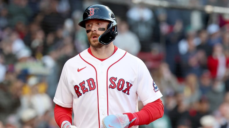 Boston Red Sox's Trevor Story runs to the dug out after scoring during the second inning of a baseball game against the New York Yankees, Thursday, April 23, 2026, in Boston. (AP Photo/Mark Stockwell)