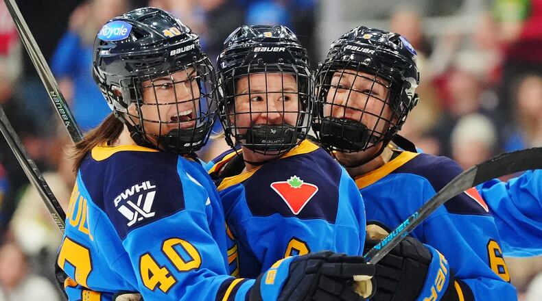 FILE - Toronto Sceptres' Blayre Turnbull (40) celebrates her goal against the Montreal Victoire with Daryl Watts, center, and Kali Flanagan (6) during the second period of an PWHL hockey game in Toronto, Tuesday, March 3, 2026. (Frank Gunn/The Canadian Press via AP,File)