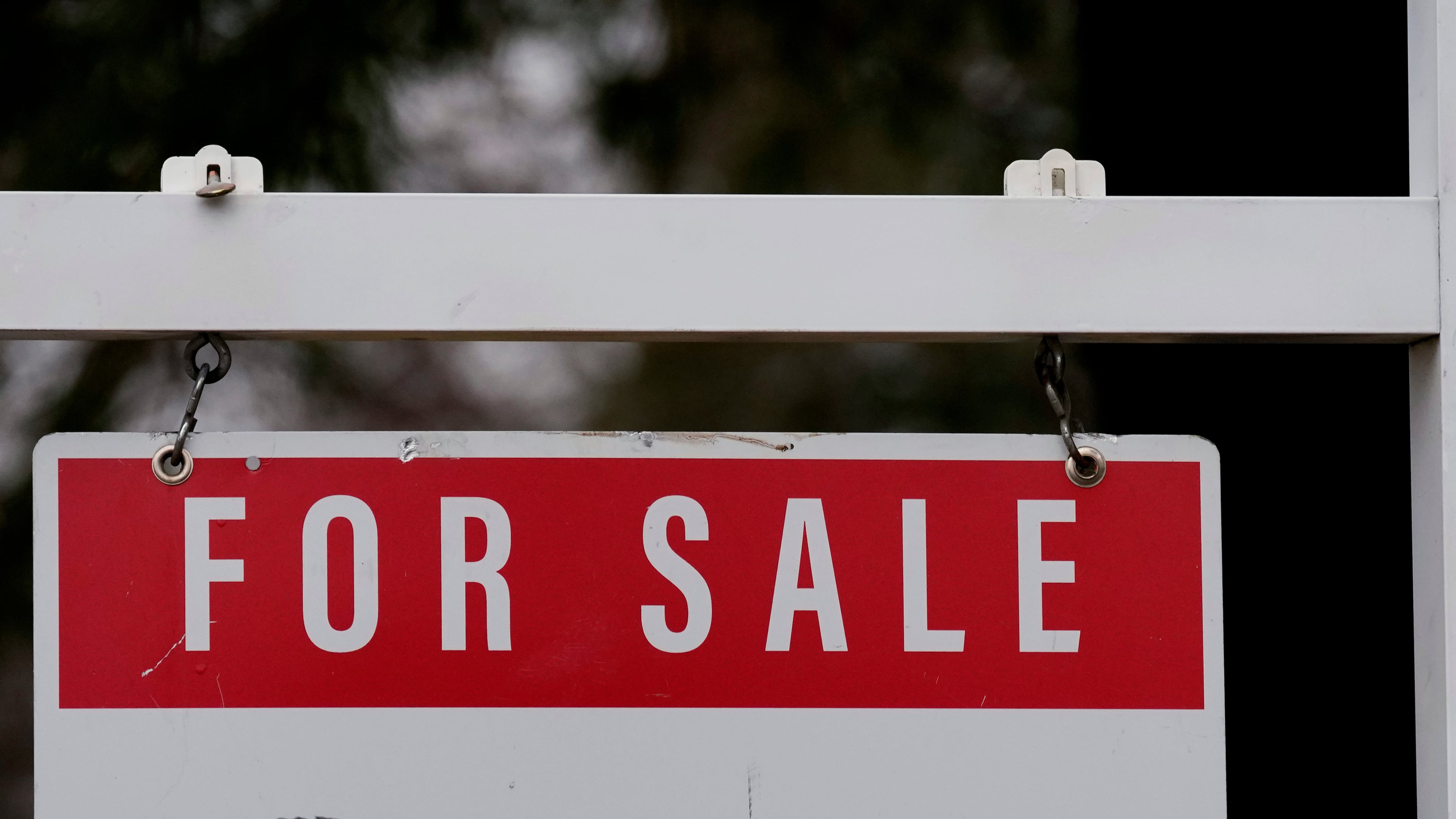 FILE - A for sale sign stands outside a residence in Wheeling, Ill., Dec. 16, 2024. (AP Photo/Nam Y. Huh, File)