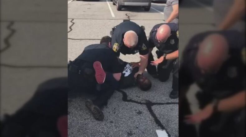The Henry County Police Department has fired Officer David Rose after video that appeared to show him choking Desmond Marrow, a former NFL player, was posted online.