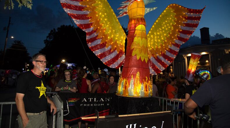 Volunteer, Greg Martin, looks out for one of the large lanterns before the start of the Atlanta BeltLine Lantern Parade in 2018. This year’s parade happens Sept. 21, in conjunction with the Old Fourth Ward Fall Fest. STEVE SCHAEFER / SPECIAL TO THE AJC