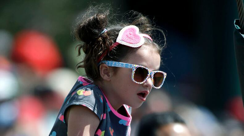 A young fan watches the Braves-Mets game Tuesday, March 8, 2016, in Kissimmee, Fla. (AP Photo/John Raoux)