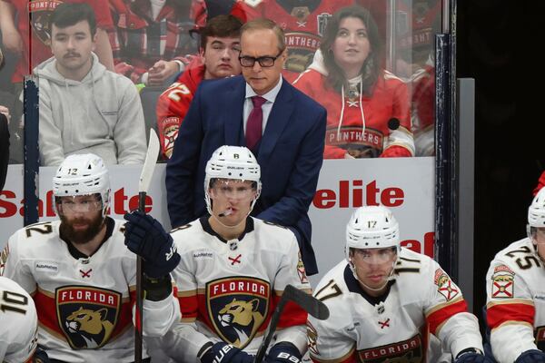 Florida Panthers coach Paul Maurice, center top, watches his team against the Columbus Blue Jackets during the third period an NHL hockey game in Columbus, Ohio, Thursday, March 20, 2025. (AP Photo/Paul Vernon)