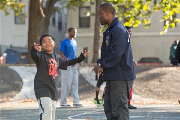 This image released by Universal Pictures shows Benjamin Flores Jr., left, and Kevin Hart in a scene from "Ride Along." (Quantrell D. Colbert/Universal Pictures/AP)