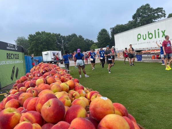 Georgia-grown peaches at finish line of Atlanta Journal-Constitution Peachtree Road Race in Atlanta on Monday, July 4, 2022.