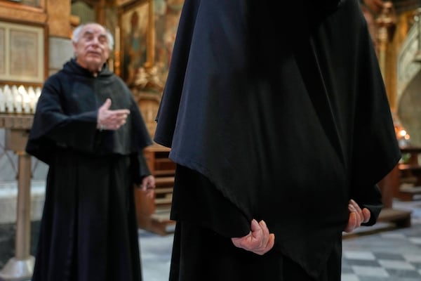 Augustinian friars Alberto Giovannetti, right, and Paolo Angelone speak during an interview in the Sanctuary of Our Mother of Good Counsel in Genazzano, Italy, Thursday, May 15, 2025. (AP Photo/Gregorio Borgia)