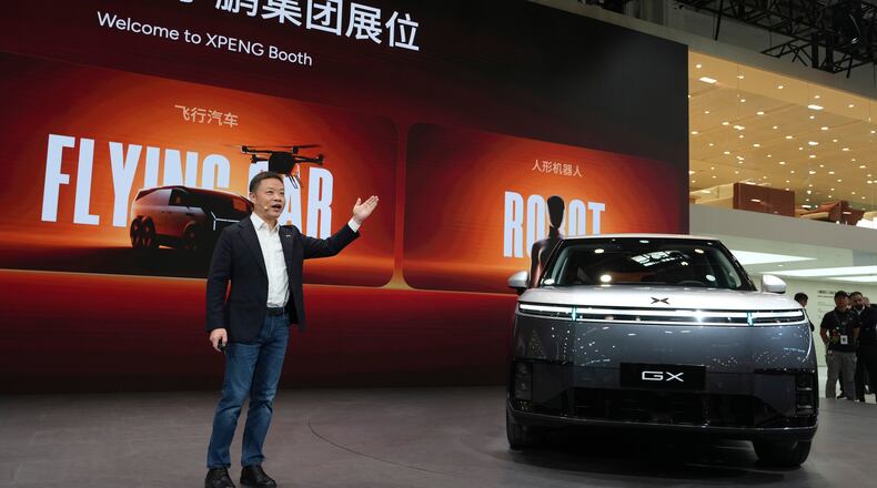 He Xiaopeng, Chairman and CEO of XPENG speaks at the Auto China 2026 in Beijing, Friday, April 24, 2026. (AP Photo/Ng Han Guan)