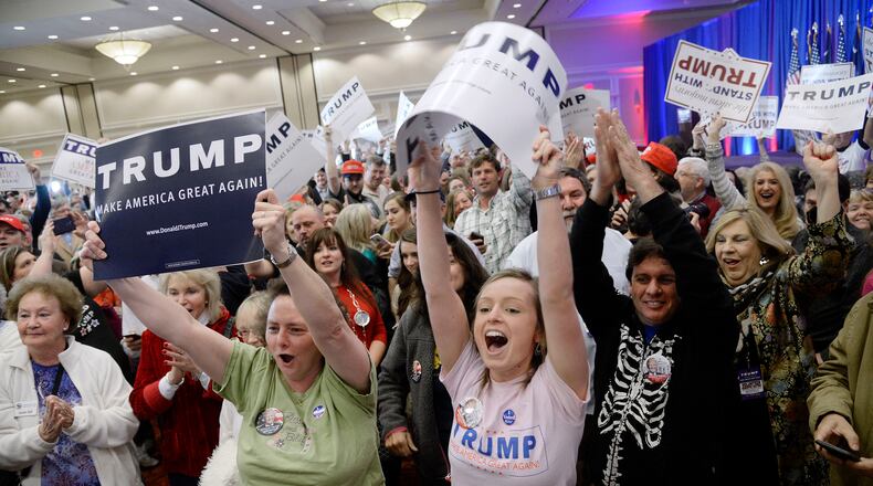 Supporters of Republican presidential candidate Donald Trump celebrate during a primary watch party in Spartanburg, S.C., on Saturday. Olivier Douliery/TNS