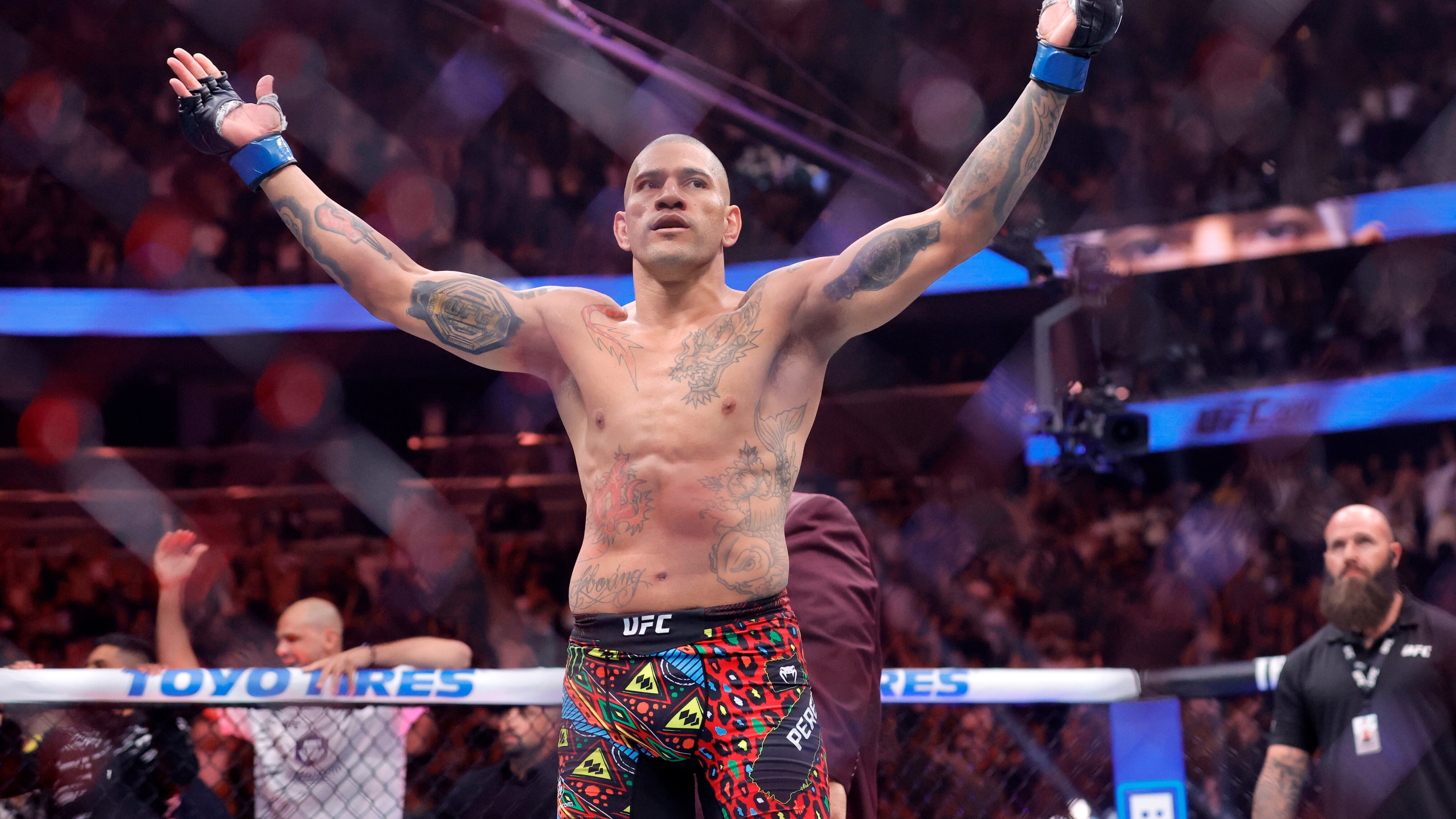 Alex Pereira, of Brazil, celebrates after defeating UFC light heavyweight champion Magomed Ankalaev, of Russia during the UFC 320 mixed martial arts bout Saturday, Oct. 4, 2025, in Las Vegas. (Steve Marcus/Las Vegas Sun via AP)