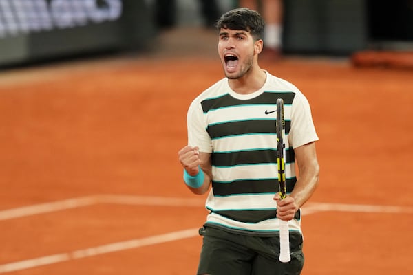 Spain's Carlos Alcaraz reacts as he plays against Italy's Lorenzo Musetti during their semifinal match of the French Tennis Open at the Roland-Garros stadium in Paris, Friday, June 6, 2025. (AP Photo/Aurelien Morissard)
