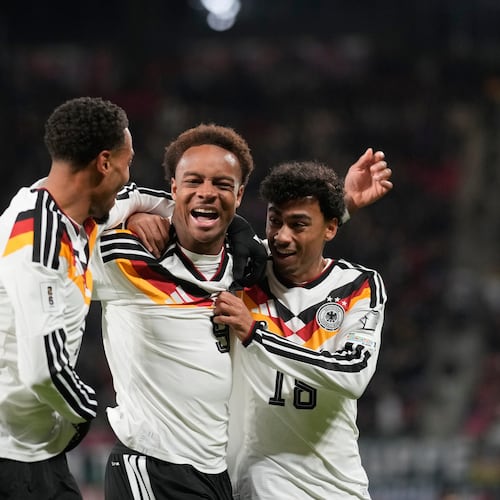 Germany's Assan Ouedraogo, center, celebrates after scoring during a group A World Cup qualifiying soccer match between Germany and Slovakia in Leipzig, Germany, Monday, Nov. 17, 2025. (AP Photo/Matthias Schrader)