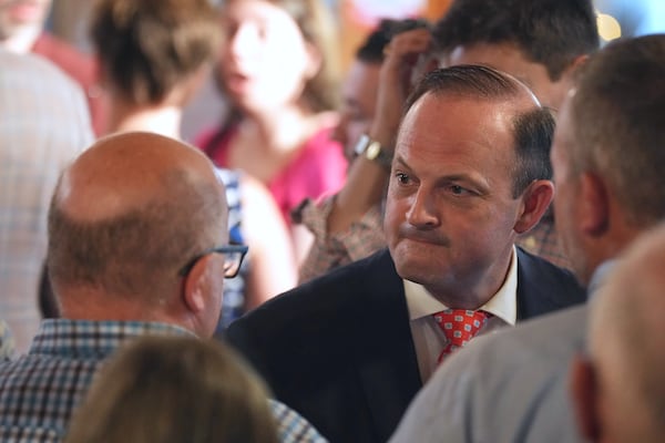 South Carolina Attorney General Alan Wilson, center, mingles with supporters at his launch event for the state's 2026 governor's race Monday, June 23, 2025, in Lexington, S.C. (AP Photo/Meg Kinnard)
