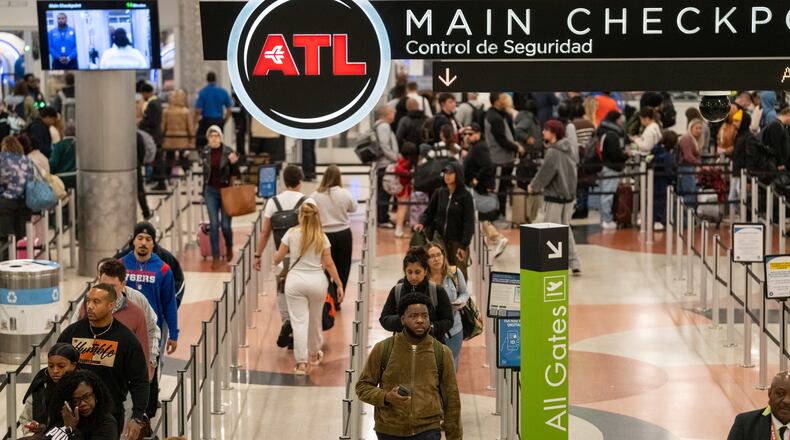 Morning travelers make their way through Hartsfield-Jackson Atlanta International Airport amid the ongoing government shutdown on Monday, October 27, 2025. (Ben Hendren for the AJC)