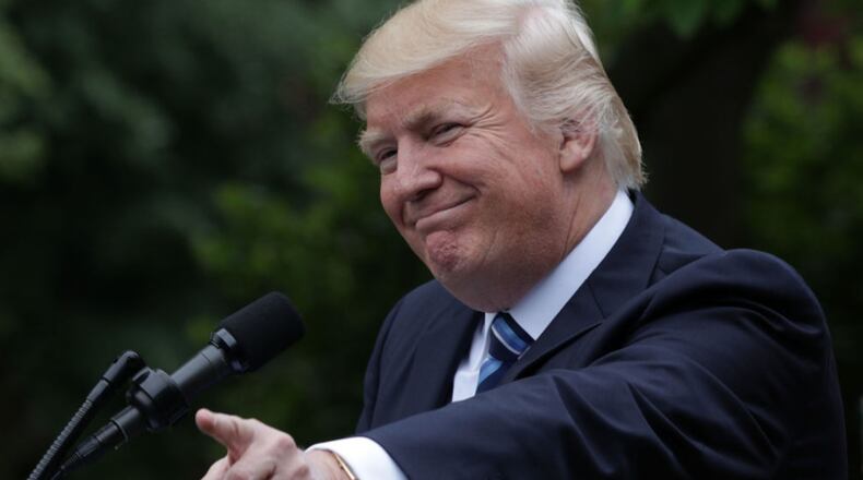 WASHINGTON, DC - MAY 04: U.S. President Donald Trump gestures as he speaks during a Rose Garden event May 4, 2017 at the White House in Washington, DC. The House has passed the American Health Care Act that will replace the Obama eraÕs Affordable Healthcare Act with a vote of 217-213. (Photo by Alex Wong/Getty Images)