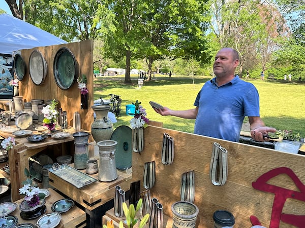 Jason Bove of Lebanon, Ohio, said his sales at the Dogwood Festival were down 30% from a year ago, blaming the gate fee as a deterrent. (Rodney Ho/AJC)