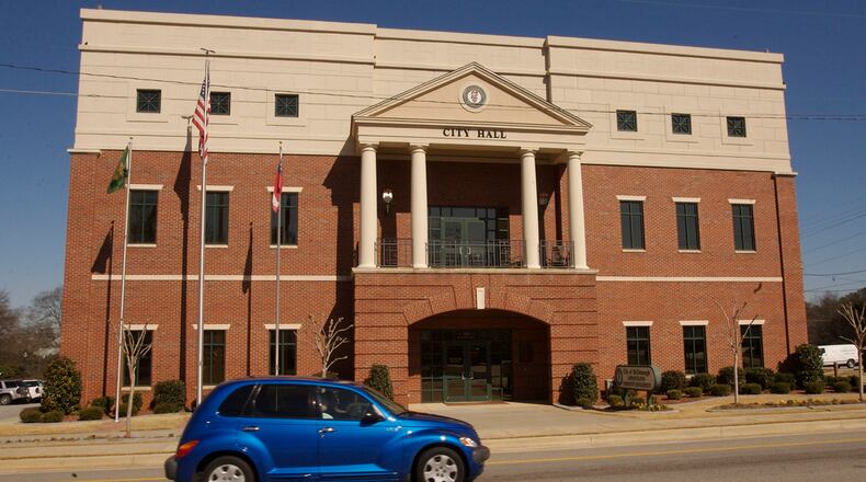 McDonough to open its government buildings on June 1. Face masks and temperature checks are required to enter the buildings.