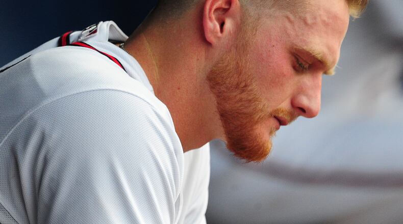 Shelby Miller of the Braves sits in the dugout after allowing a four-run first inning against Washington Tuesday night. (Scott Cunningham/Getty Images)