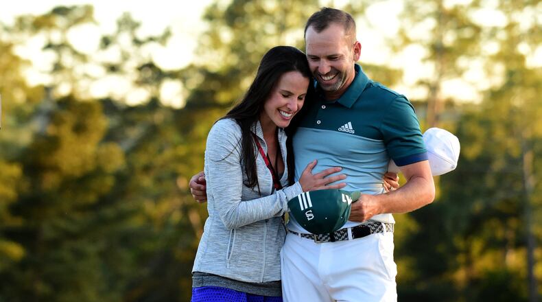Sergio Garcia and then-fiancee Angela Akins share a moment after his breakthrough 2017 Masters victory. (Harry How/Getty Images)
