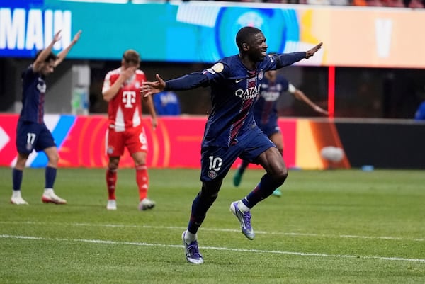 Paris Saint-Germain's Ousmane Dembélé celebrates after scoring his team's second goal during the Club World Cup quarterfinal soccer match between PSG and Bayern Munich on Saturday, July 5, 2025, in Atlanta. (Brynn Anderson/AP)